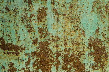 Old rusty metal surface. Old paint falls off the metal. The structure of the old paint.