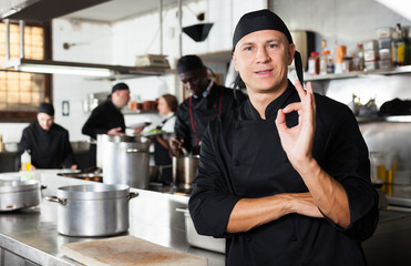Professional male chef in kitchen of restaurant