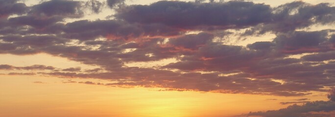 Fototapeta na wymiar beautiful orange and blue sky with clouds at the sunrise with sun ray look like heaven