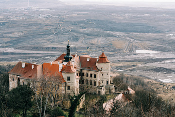 Castle standing next to a huge coal mine
