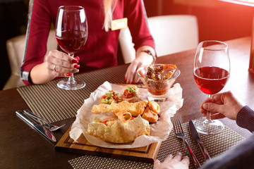 newlyweds husband and wife have dinner in a cafe
