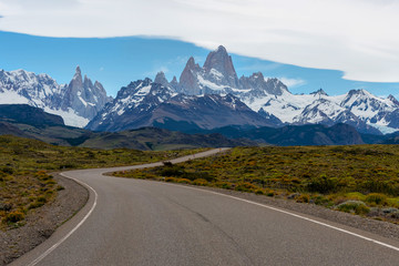 Empty road with the Mount Fitz Roy on the background. Patagonia, Argentina