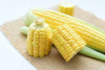  fresh organic corn in leaf, shelled and in pieces