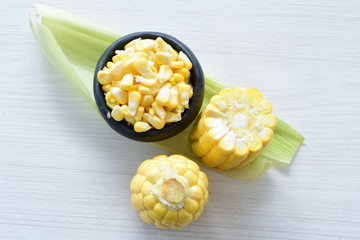  fresh organic corn in leaf, shelled and in pieces