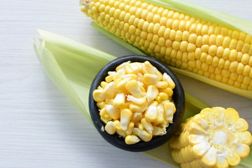  fresh organic corn in leaf, shelled and in pieces