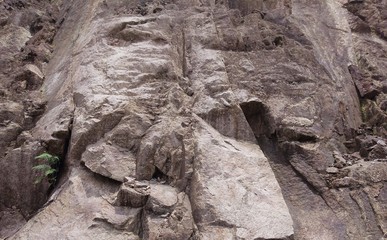 fractured granitic rocks outcrop near the road