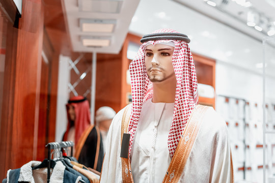 kufiya - traditional Arabic men's headdress on a mannequin in an Oriental fashion and clothing store in Dubai