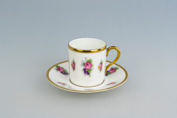 Vintage bright mocha cup on grey background 