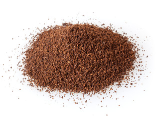 Heap of ground roasted coffee beans isolated on white background