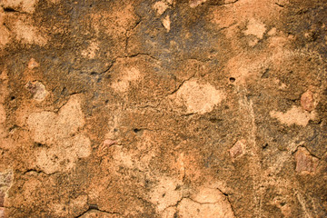 Pattern of Rough Grunge Vintage Stone Wall Texture light yellow Color Background