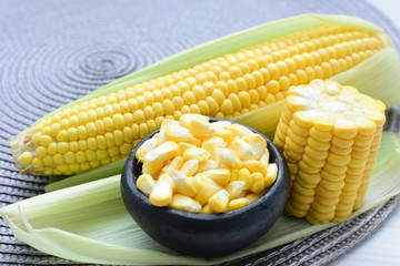  fresh organic corn in leaf, shelled and in pieces