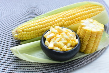  fresh organic corn in leaf, shelled and in pieces