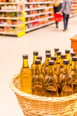 Bottles of olive oil on counter of market