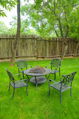 Garden furniture with built-in barbecue hearth fireplace in the table. Recreation area with a...