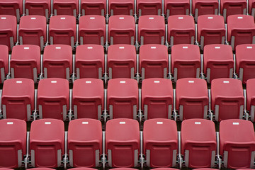 Rows of red empty seats in stadium