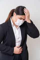 Asian women wearing surgical face mask to prevent flu disease Corona virus and PM 2.5 dust