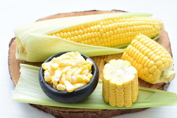  fresh organic corn in leaf, shelled and in pieces