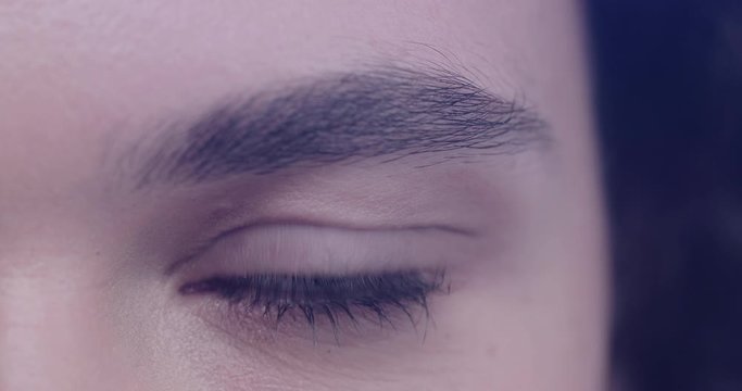 Close up of female eye with facial recognition scanner reading eye pupil