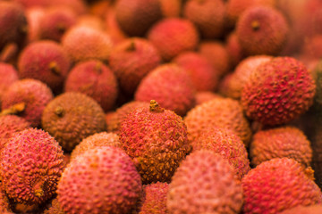 Tropical fruit lychee. Fresh raw organic lychee fruit for sale at farmers market or shop. Vegan food, healthy nutrition, fruit.