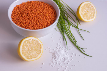 red lentils in a cup with lemon