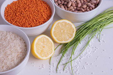 red lentils and beans in cups with lemon and herbs