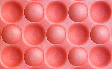 Concave convex circles on a red background