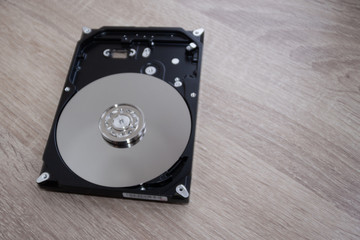 Disassembled computer hard drive device close-up. Dismantling inspection cleaning and repair of...