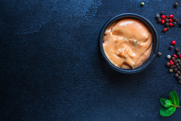 barbecue sauce (gravy boat, addition to the main course of vegetables, tomatoes and spices) menu concept. background. top view. copy space