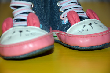 Blue kids shoes with pink soles and pink and white laces. Stylish baby. Fashion footwear. Children's sports shoes. Fashion