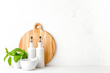 Kitchen background, front view kitchen utensils on white countertop