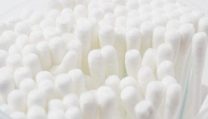 Lots of cotton swabs in close-up, selective focus