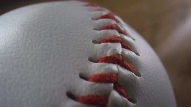 Close up macro of a traditional baseball with emphasis on the leather and stitching