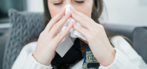 Young ill woman at home