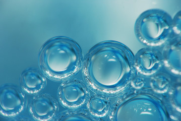 Abstract background of many small bubbles in the water, under a large increase.