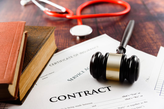 A Medical Insurance Contract Is Brought To Court By A Plaintiff For The Judge To Decide.