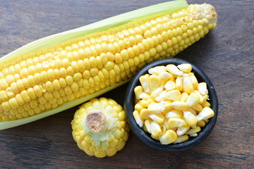 fresh organic corn in leaf, shelled and in pieces