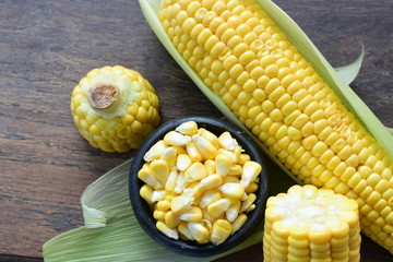 fresh organic corn in leaf, shelled and in pieces