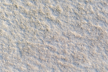 Horizontal photography of texture of fresh white snow covering ground thickly on frosty winter...