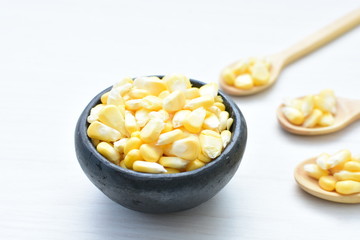 fresh organic corn in leaf, shelled and in pieces