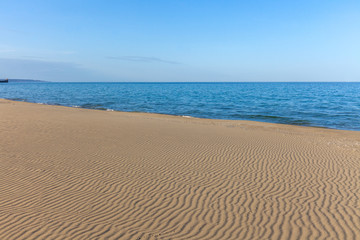 View of blue sea waves at sandy beach. Horizon line. Caspian Sea, sandstone coast. ustyurt. Selective focus, long shutter speed