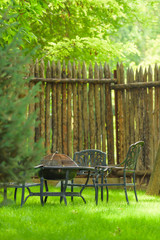 Garden furniture with built-in barbecue hearth fireplace in the table. Recreation area with a...
