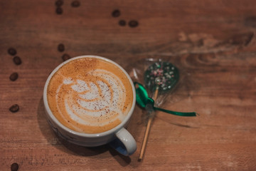 cup of coffee on wooden background