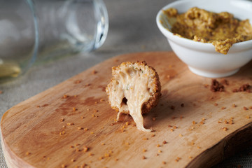 Bitterballen are a Dutch meat-based snack, made by making a very thick stew thickened with roux and beef stock and generously loaded with meat.