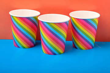 multicolored Paper Cups on a bright background