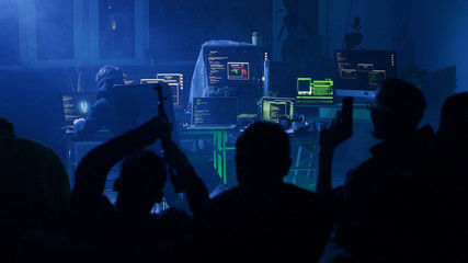 LVIV, UKRAINE - 9 JUNE, 2019: Bad guys gang with guns hacking and trying to steal important data in...