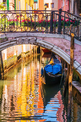  Picturesque canal with a gondola, Venice, Italy