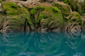 Amazing crystalline blue water of Tamul waterfall, Close up view of spectacular Tamul River,at Huasteca Potosina in San Luis Potosi, Mexico