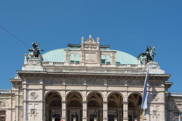Vienna, Austria - June 4, 2019; Roof of the Wiener Staatoper, one of the leader opera houses in Europe on a blue sky, a famous landmark in the center of Vienna