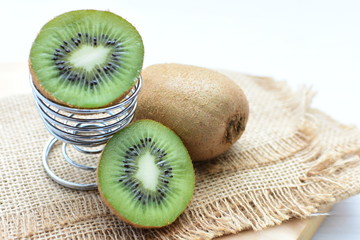  Fresh whole kiwi and half kiwi showing its texture