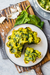 Spinach stuffed tart, baked pie with mashed potato. Vegan healthy food. 